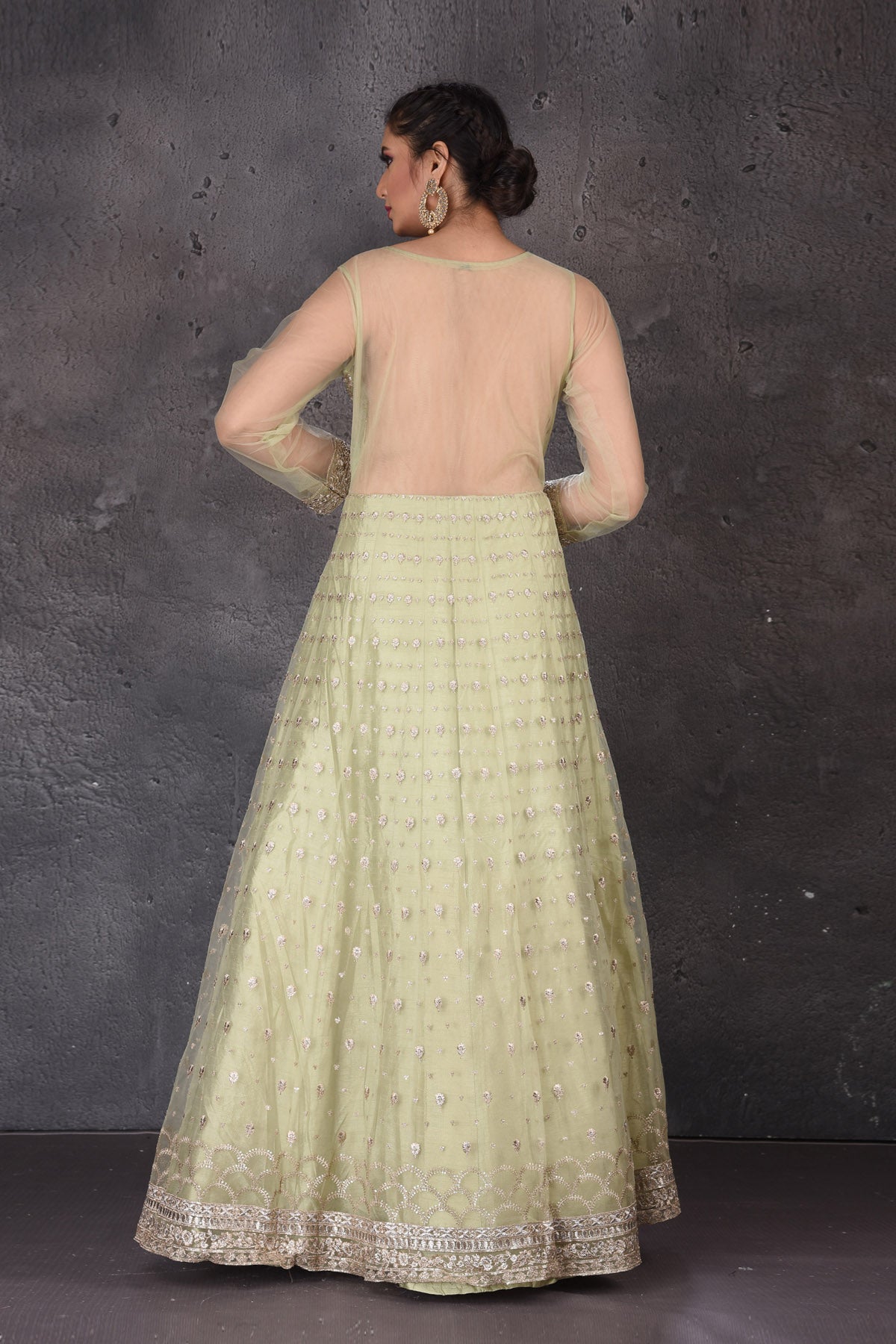 Buy beautiful pista green embroidered Anarkali suit online in USA with dupatta. Look elegant at weddings and festive occasions in exclusive designer suits, designer gowns, Anarkali suits, sharara suits, wedding gowns, palazzo suits, designer lehenga from Pure Elegance Indian clothing store in USA.-back