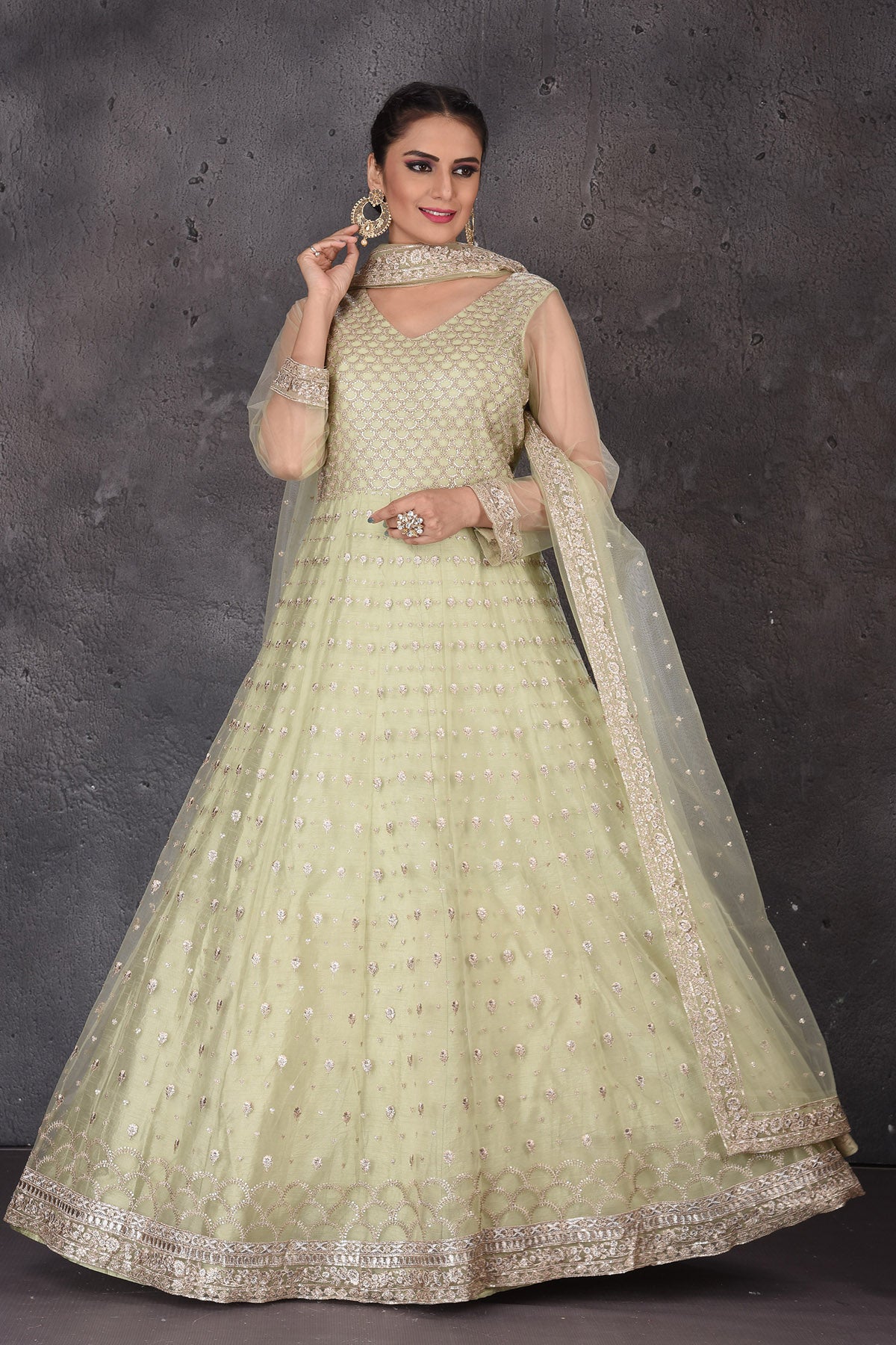 Buy beautiful pista green embroidered Anarkali suit online in USA with dupatta. Look elegant at weddings and festive occasions in exclusive designer suits, designer gowns, Anarkali suits, sharara suits, wedding gowns, palazzo suits, designer lehenga from Pure Elegance Indian clothing store in USA.-full view