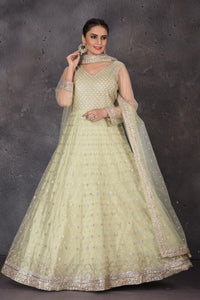 Buy beautiful pista green embroidered Anarkali suit online in USA with dupatta. Look elegant at weddings and festive occasions in exclusive designer suits, designer gowns, Anarkali suits, sharara suits, wedding gowns, palazzo suits, designer lehenga from Pure Elegance Indian clothing store in USA.-full view