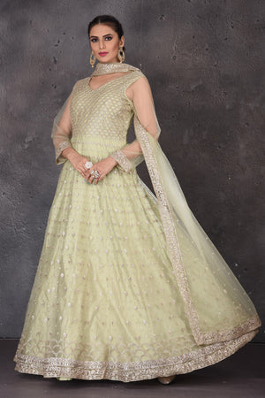 Buy beautiful pista green embroidered Anarkali suit online in USA with dupatta. Look elegant at weddings and festive occasions in exclusive designer suits, designer gowns, Anarkali suits, sharara suits, wedding gowns, palazzo suits, designer lehenga from Pure Elegance Indian clothing store in USA.-side