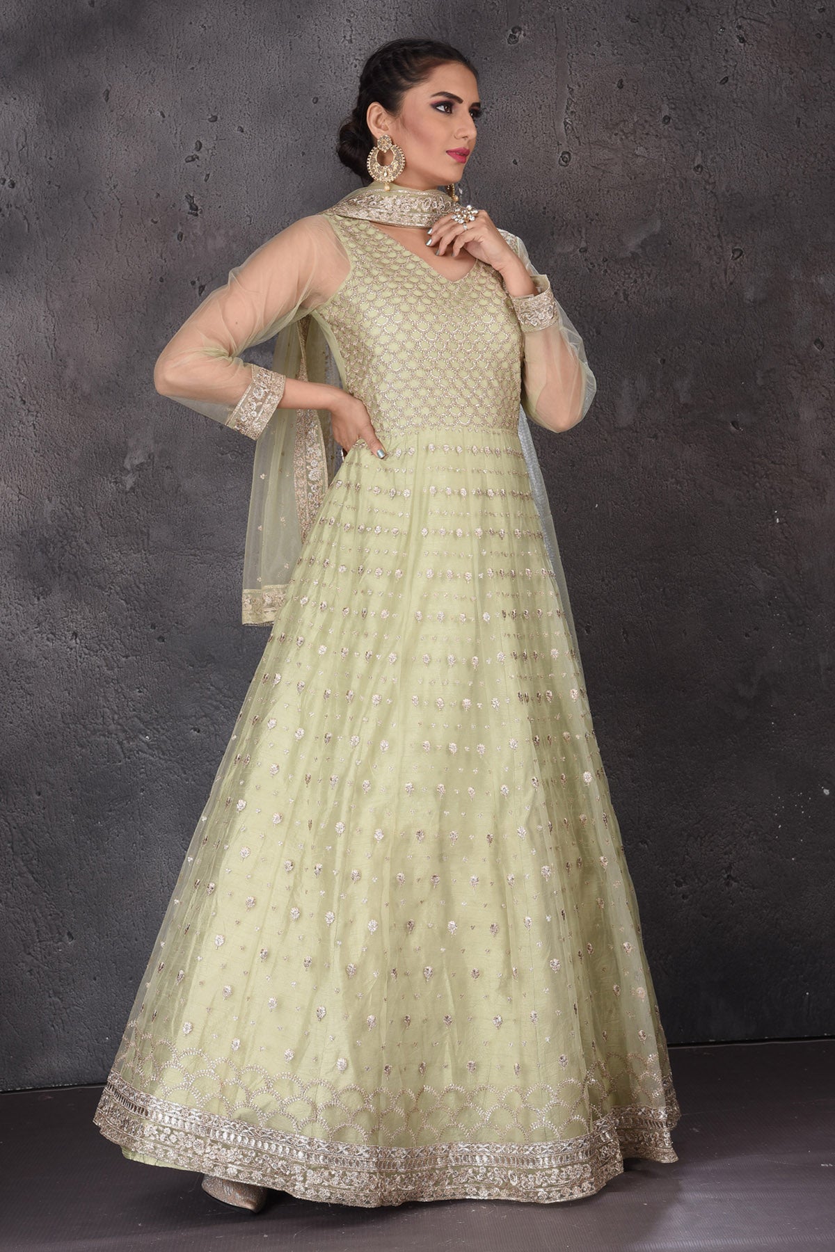 Buy beautiful pista green embroidered Anarkali suit online in USA with dupatta. Look elegant at weddings and festive occasions in exclusive designer suits, designer gowns, Anarkali suits, sharara suits, wedding gowns, palazzo suits, designer lehenga from Pure Elegance Indian clothing store in USA.-right