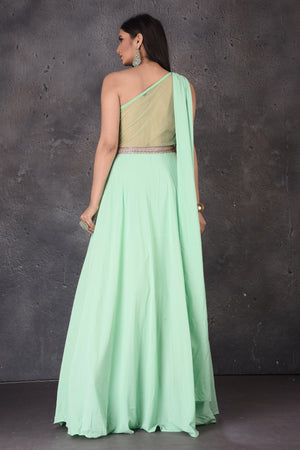 Buy stunning mint green one shoulder designer gown online in USA. Look elegant at weddings and festive occasions in exclusive designer suits, designer gowns, Anarkali suits, sharara suits, wedding gowns, palazzo suits, designer lehenga from Pure Elegance Indian clothing store in USA.-back