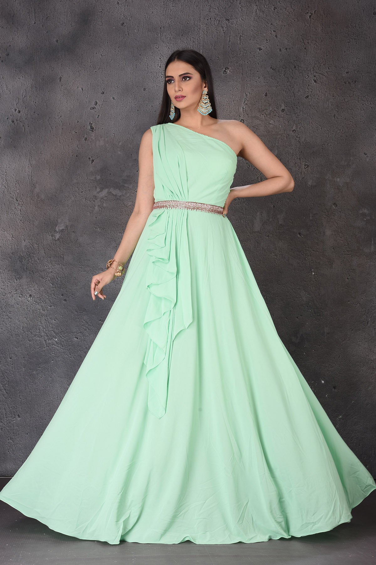 Buy stunning mint green one shoulder designer gown online in USA. Look elegant at weddings and festive occasions in exclusive designer suits, designer gowns, Anarkali suits, sharara suits, wedding gowns, palazzo suits, designer lehenga from Pure Elegance Indian clothing store in USA.-full view