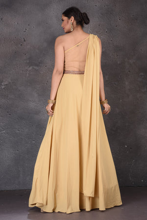 Shop gorgeous yellow one shoulder designer gown online in USA. Look elegant at weddings and festive occasions in exclusive designer suits, designer gowns, Anarkali suits, sharara suits, wedding gowns, palazzo suits, designer lehenga from Pure Elegance Indian clothing store in USA.-back