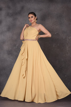 Buy gorgeous mellow yellow one shoulder designer gown online in USA. Look elegant at weddings and festive occasions in exclusive designer suits, designer gowns, Anarkali suits, sharara suits, wedding gowns, palazzo suits, designer lehenga from Pure Elegance Indian clothing store in USA.-front