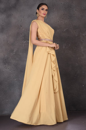 Buy gorgeous mellow yellow one shoulder designer gown online in USA. Look elegant at weddings and festive occasions in exclusive designer suits, designer gowns, Anarkali suits, sharara suits, wedding gowns, palazzo suits, designer lehenga from Pure Elegance Indian clothing store in USA.-side