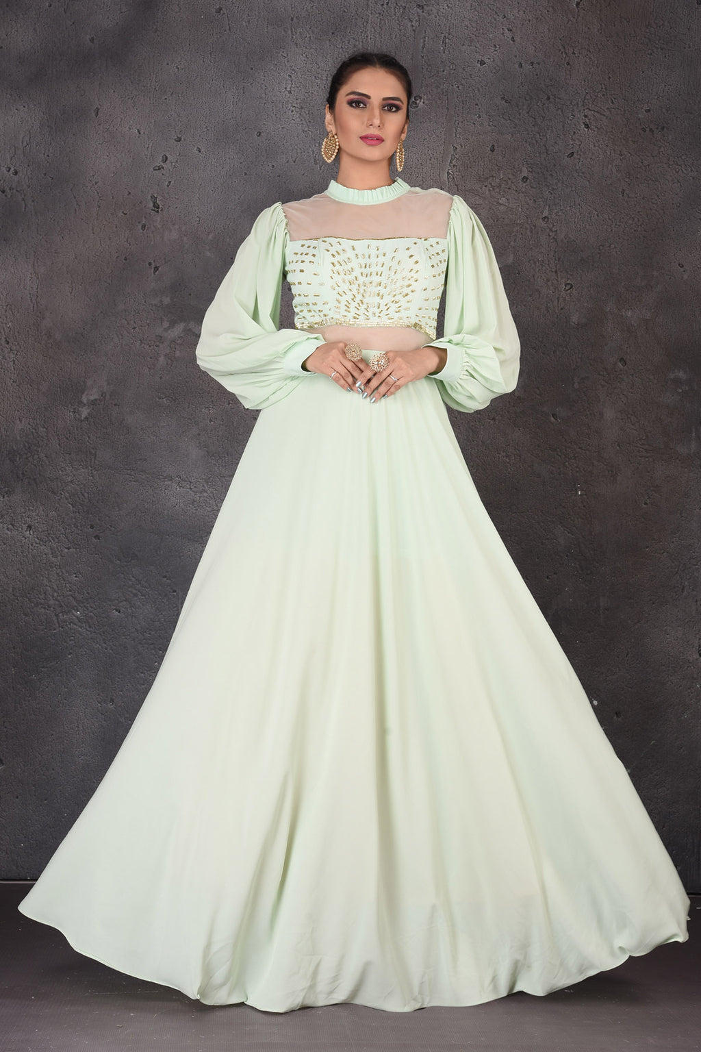 Shop beautiful mint green designer gown online in USA with puff sleeves. Look elegant at weddings and festive occasions in exclusive designer suits, designer gowns, Anarkali suits, sharara suits, wedding gowns, palazzo suits, designer lehenga from Pure Elegance Indian clothing store in USA.-full view