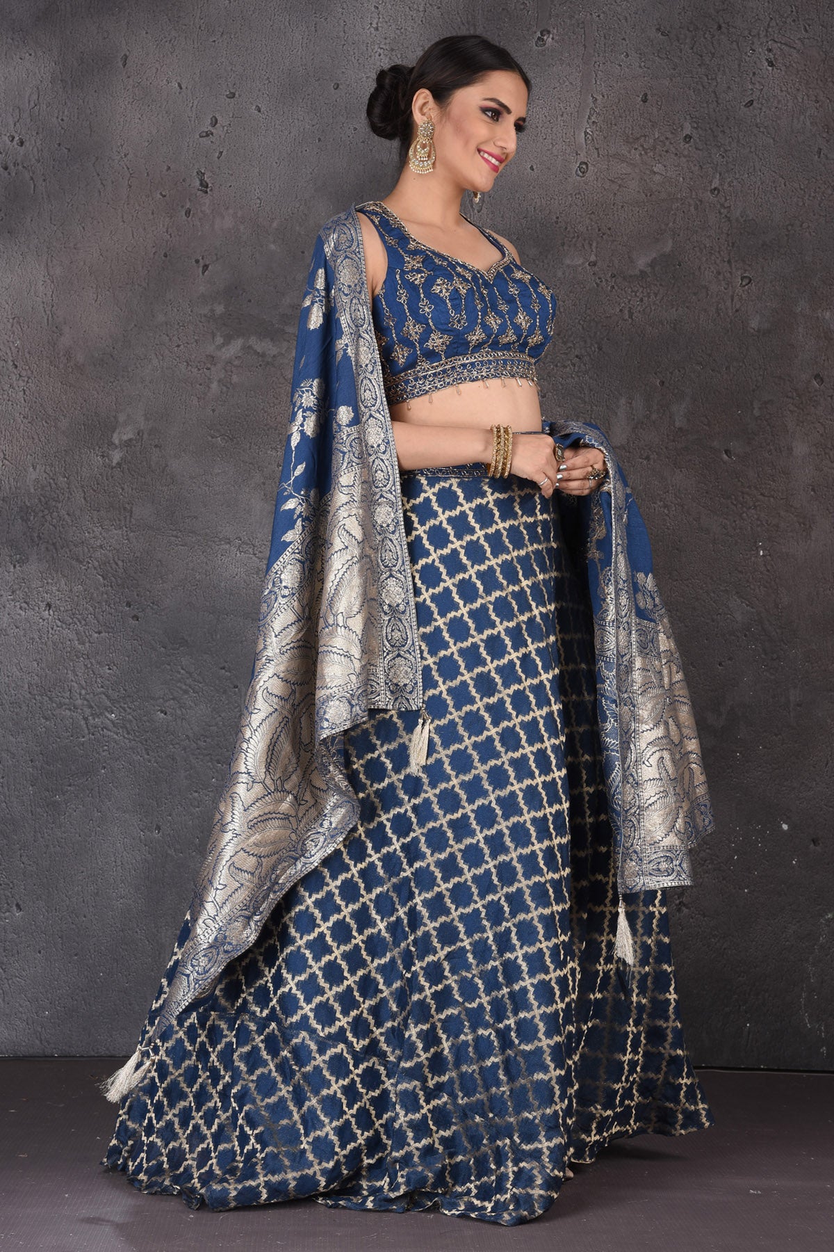 Shop beautiful blue embroidered designer lehenga online in USA with dupatta. Look elegant at weddings and festive occasions in exclusive designer suits, designer gowns, Anarkali suits, sharara suits, wedding gowns, palazzo suits, designer lehenga from Pure Elegance Indian clothing store in USA.-side