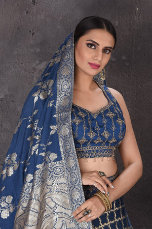 Shop beautiful blue embroidered designer lehenga online in USA with dupatta. Look elegant at weddings and festive occasions in exclusive designer suits, designer gowns, Anarkali suits, sharara suits, wedding gowns, palazzo suits, designer lehenga from Pure Elegance Indian clothing store in USA.-closeup