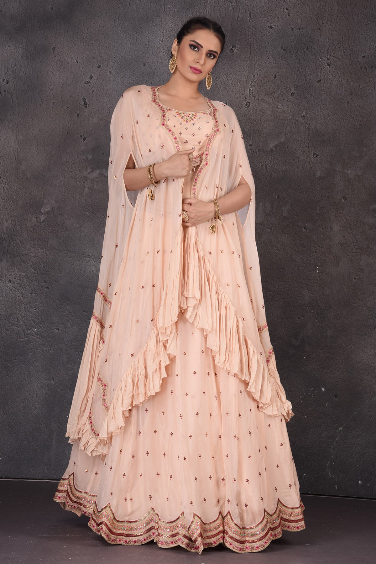 Buy stunning powder pink embroidered designer lehenga online in USA with cape dupatta. Look elegant at weddings and festive occasions in exclusive designer suits, designer gowns, Anarkali suits, sharara suits, wedding gowns, palazzo suits, designer lehenga from Pure Elegance Indian clothing store in USA.-full view