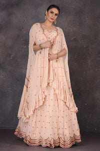 Buy stunning powder pink embroidered designer lehenga online in USA with cape dupatta. Look elegant at weddings and festive occasions in exclusive designer suits, designer gowns, Anarkali suits, sharara suits, wedding gowns, palazzo suits, designer lehenga from Pure Elegance Indian clothing store in USA.-full view
