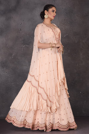 Buy stunning powder pink embroidered designer lehenga online in USA with cape dupatta. Look elegant at weddings and festive occasions in exclusive designer suits, designer gowns, Anarkali suits, sharara suits, wedding gowns, palazzo suits, designer lehenga from Pure Elegance Indian clothing store in USA.-side