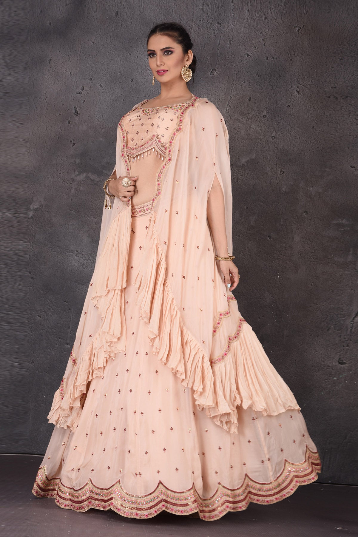 Buy stunning powder pink embroidered designer lehenga online in USA with cape dupatta. Look elegant at weddings and festive occasions in exclusive designer suits, designer gowns, Anarkali suits, sharara suits, wedding gowns, palazzo suits, designer lehenga from Pure Elegance Indian clothing store in USA.-left