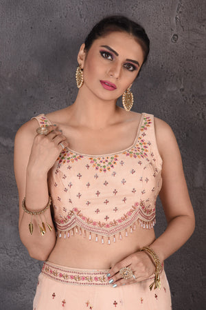 Buy stunning powder pink embroidered designer lehenga online in USA with cape dupatta. Look elegant at weddings and festive occasions in exclusive designer suits, designer gowns, Anarkali suits, sharara suits, wedding gowns, palazzo suits, designer lehenga from Pure Elegance Indian clothing store in USA.-closeup