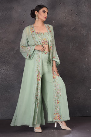Buy sage green embroidered crop top online in USA with palazzo and shrug. Look elegant at weddings and festive occasions in exclusive designer suits, designer gowns, Anarkali suits, sharara suits, wedding gowns, palazzo suits, designer lehenga from Pure Elegance Indian clothing store in USA.-front