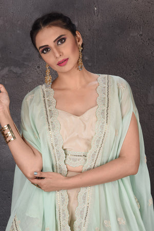 Buy golden embroidered crop top online in USA with palazzo and mint green shrug. Look elegant at weddings and festive occasions in exclusive designer suits, designer gowns, Anarkali suits, sharara suits, wedding gowns, palazzo suits, designer lehenga from Pure Elegance Indian clothing store in USA.-closeup