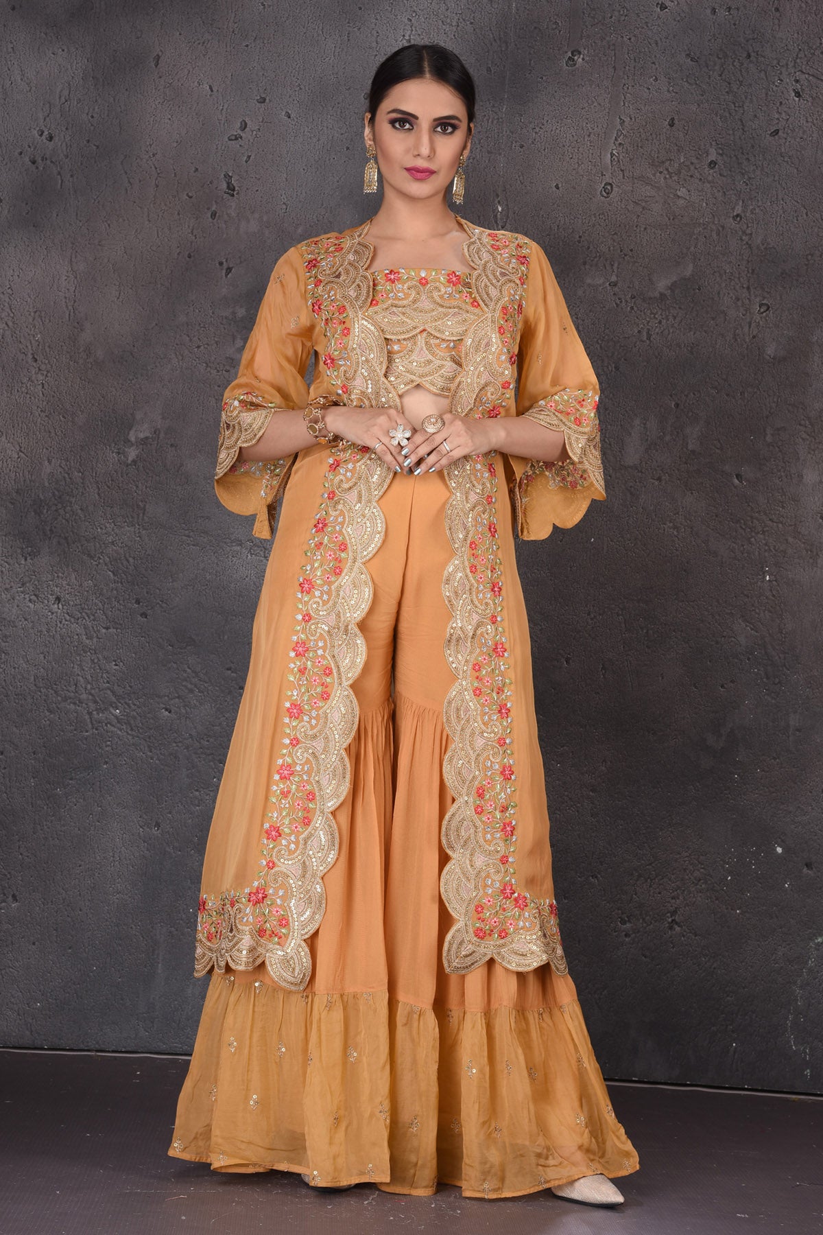 Buy stunning yellow embroidered crop top online in USA with palazzo and shrug. Look elegant at weddings and festive occasions in exclusive designer suits, designer gowns, Anarkali suits, sharara suits, wedding gowns, palazzo suits, designer lehenga from Pure Elegance Indian clothing store in USA.-front