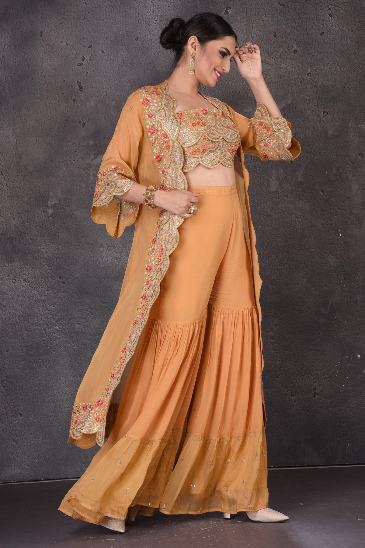 Buy stunning yellow embroidered crop top online in USA with palazzo and shrug. Look elegant at weddings and festive occasions in exclusive designer suits, designer gowns, Anarkali suits, sharara suits, wedding gowns, palazzo suits, designer lehenga from Pure Elegance Indian clothing store in USA.-side