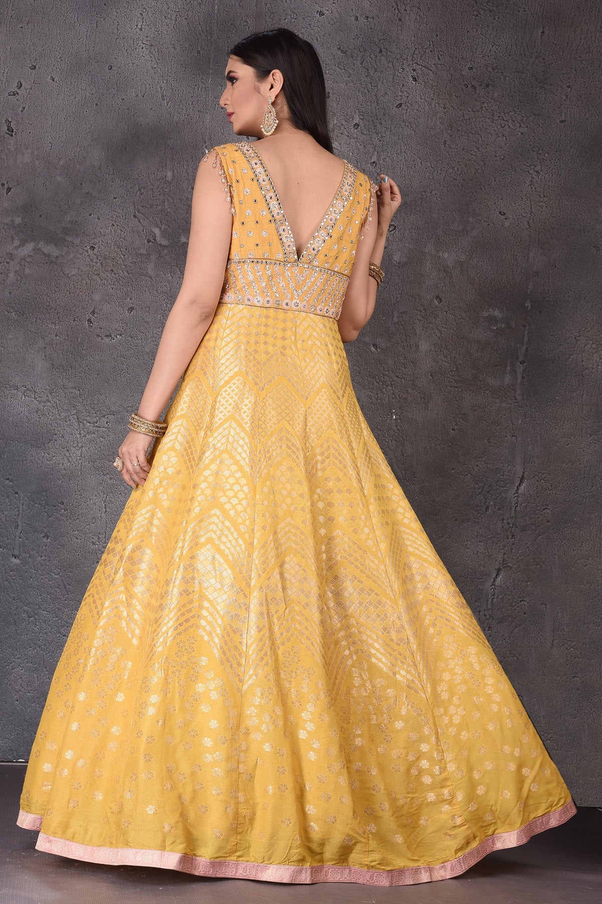 Buy stunning yellow embroidered  Anarkali suit online in USA with pink dupatta. Look elegant at weddings and festive occasions in exclusive designer suits, designer gowns, Anarkali suits, sharara suits, wedding gowns, palazzo suits, designer lehenga from Pure Elegance Indian clothing store in USA.-back