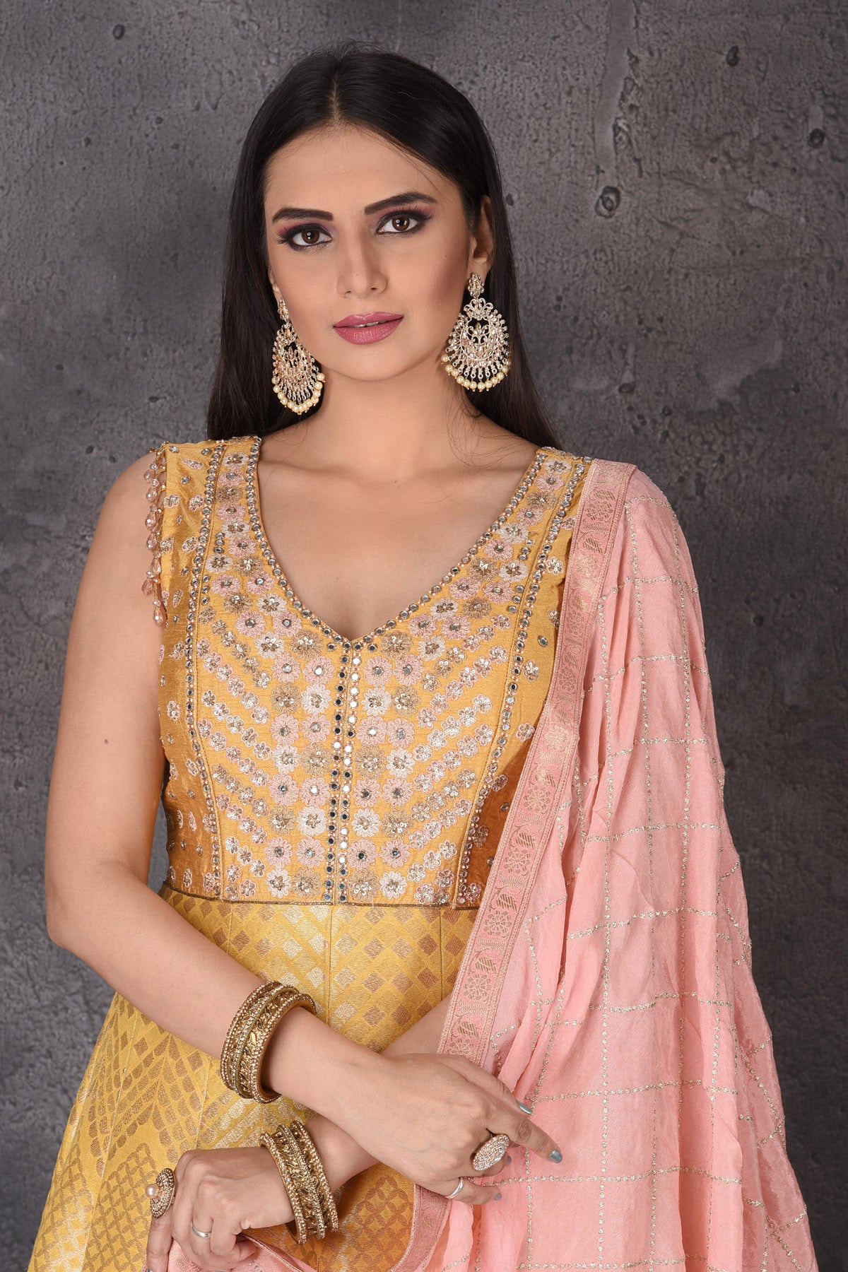 Buy stunning yellow embroidered  Anarkali suit online in USA with pink dupatta. Look elegant at weddings and festive occasions in exclusive designer suits, designer gowns, Anarkali suits, sharara suits, wedding gowns, palazzo suits, designer lehenga from Pure Elegance Indian clothing store in USA.-closeup
