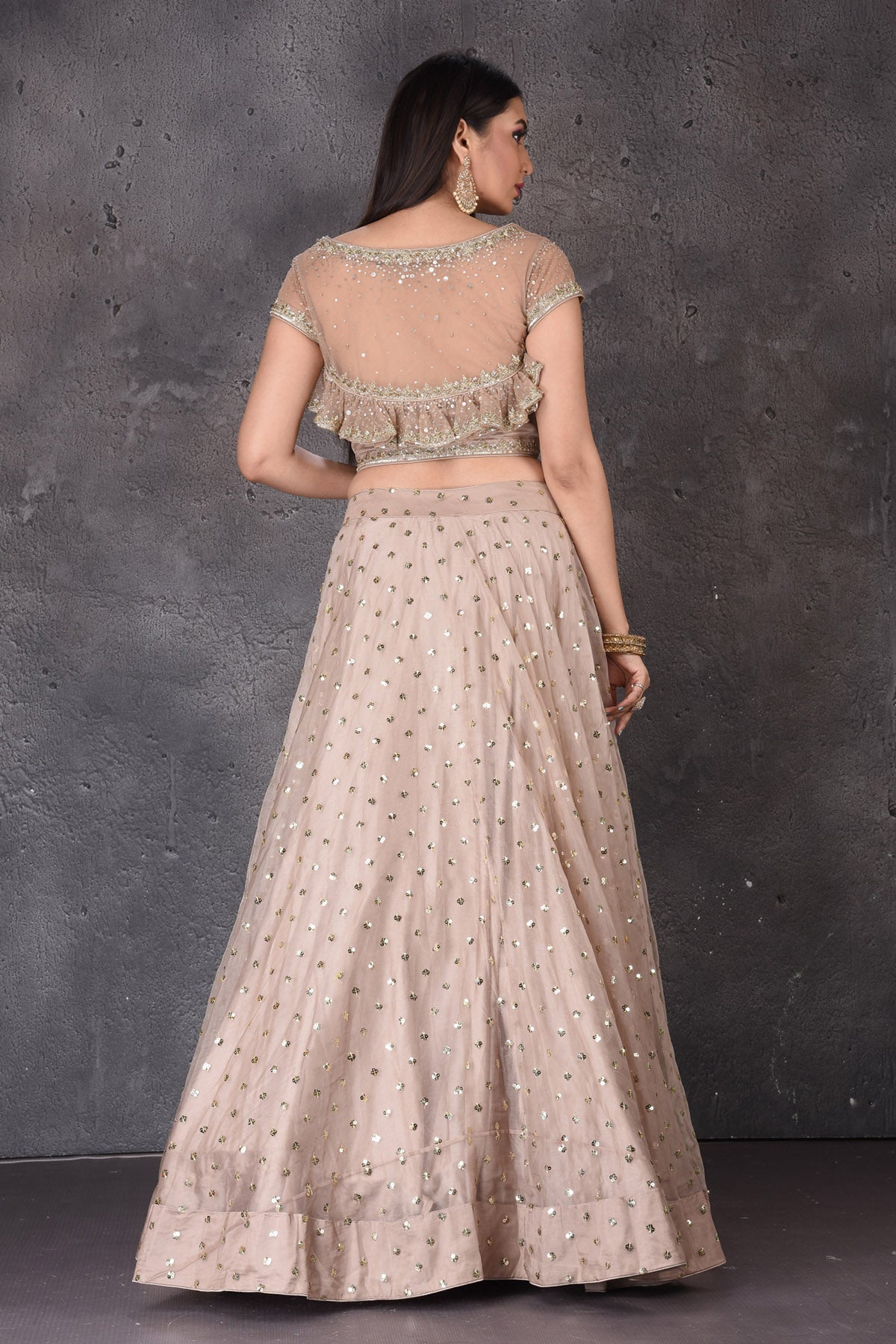 Buy stunning beige embroidered  designer lehenga online in USA with dupatta. Look elegant at weddings and festive occasions in exclusive designer suits, designer gowns, Anarkali suits, sharara suits, wedding gowns, palazzo suits, designer lehenga from Pure Elegance Indian clothing store in USA.-back