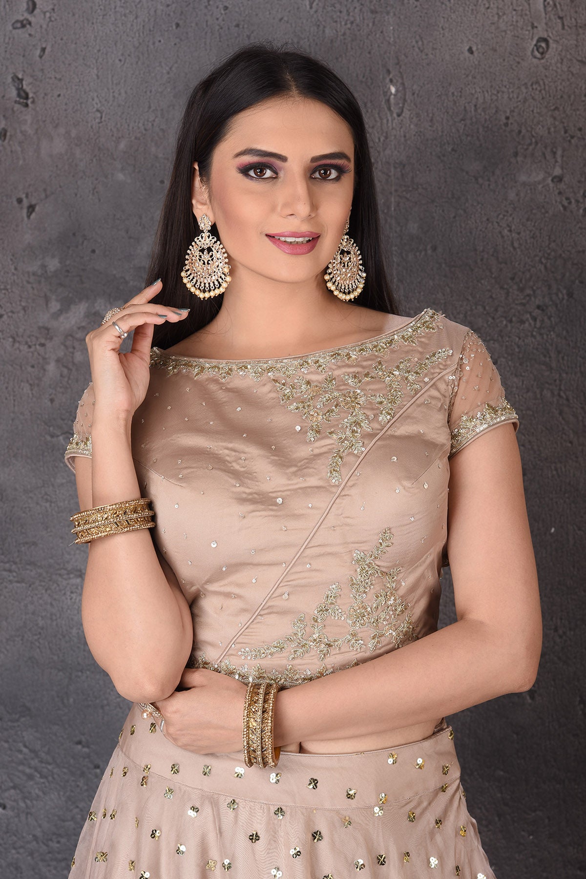 Buy stunning beige embroidered  designer lehenga online in USA with dupatta. Look elegant at weddings and festive occasions in exclusive designer suits, designer gowns, Anarkali suits, sharara suits, wedding gowns, palazzo suits, designer lehenga from Pure Elegance Indian clothing store in USA.-closeup