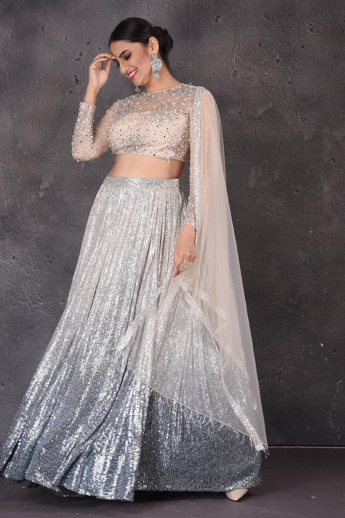 Buy stunning grey and beige sequin work designer lehenga online in USA with dupatta. Look elegant at weddings and festive occasions in exclusive designer suits, designer gowns, Anarkali suits, sharara suits, wedding gowns, palazzo suits, designer lehenga from Pure Elegance Indian clothing store in USA.-front