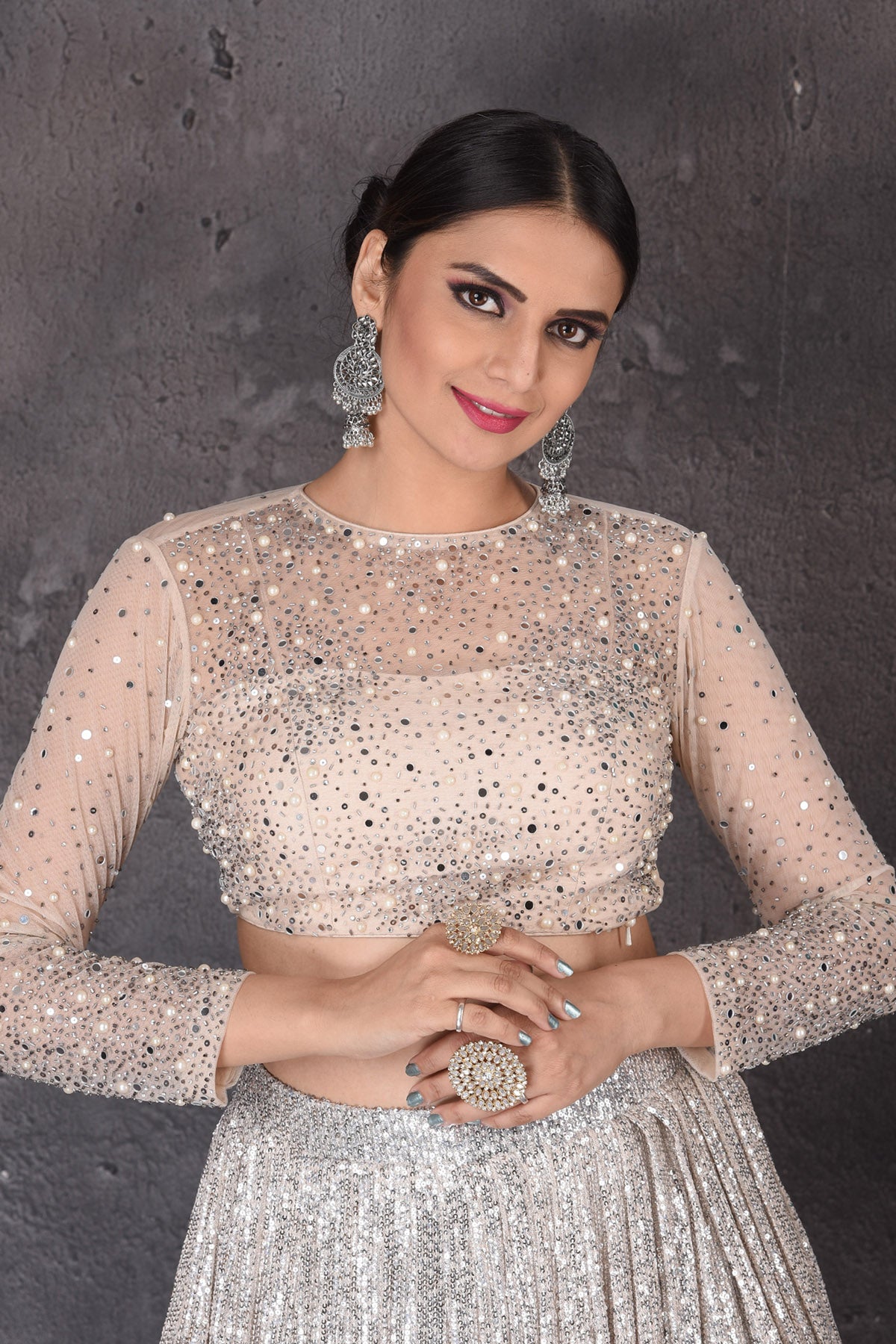 Buy stunning grey and beige sequin work designer lehenga online in USA with dupatta. Look elegant at weddings and festive occasions in exclusive designer suits, designer gowns, Anarkali suits, sharara suits, wedding gowns, palazzo suits, designer lehenga from Pure Elegance Indian clothing store in USA.-closeup