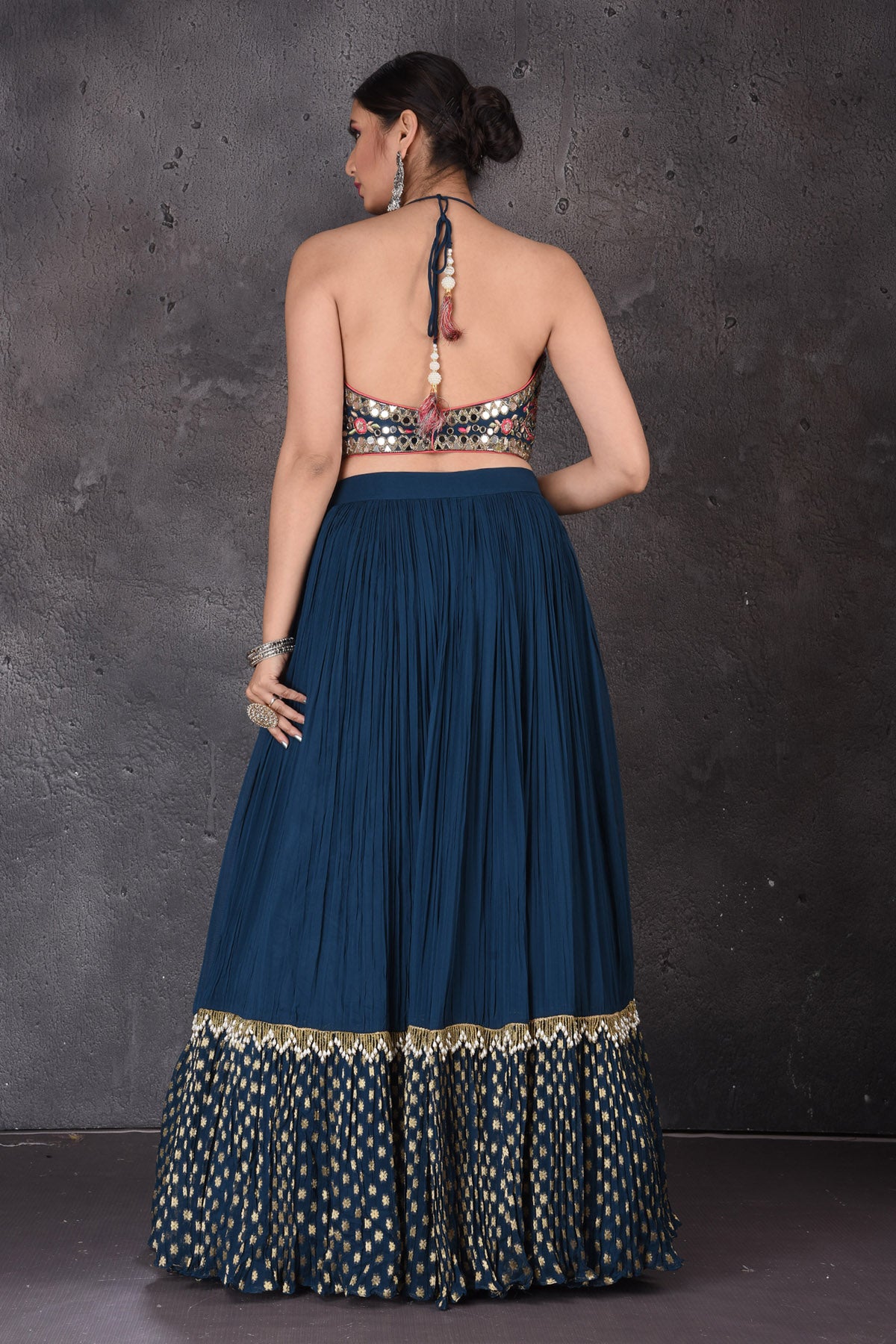 Buy stunning dark blue embroidered lehenga online in USA with pink dupatta. Look elegant at weddings and festive occasions in exclusive designer suits, designer gowns, Anarkali suits, sharara suits, wedding gowns, palazzo suits, designer lehenga from Pure Elegance Indian clothing store in USA.-back