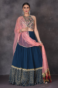 Buy stunning dark blue embroidered lehenga online in USA with pink dupatta. Look elegant at weddings and festive occasions in exclusive designer suits, designer gowns, Anarkali suits, sharara suits, wedding gowns, palazzo suits, designer lehenga from Pure Elegance Indian clothing store in USA.-full view
