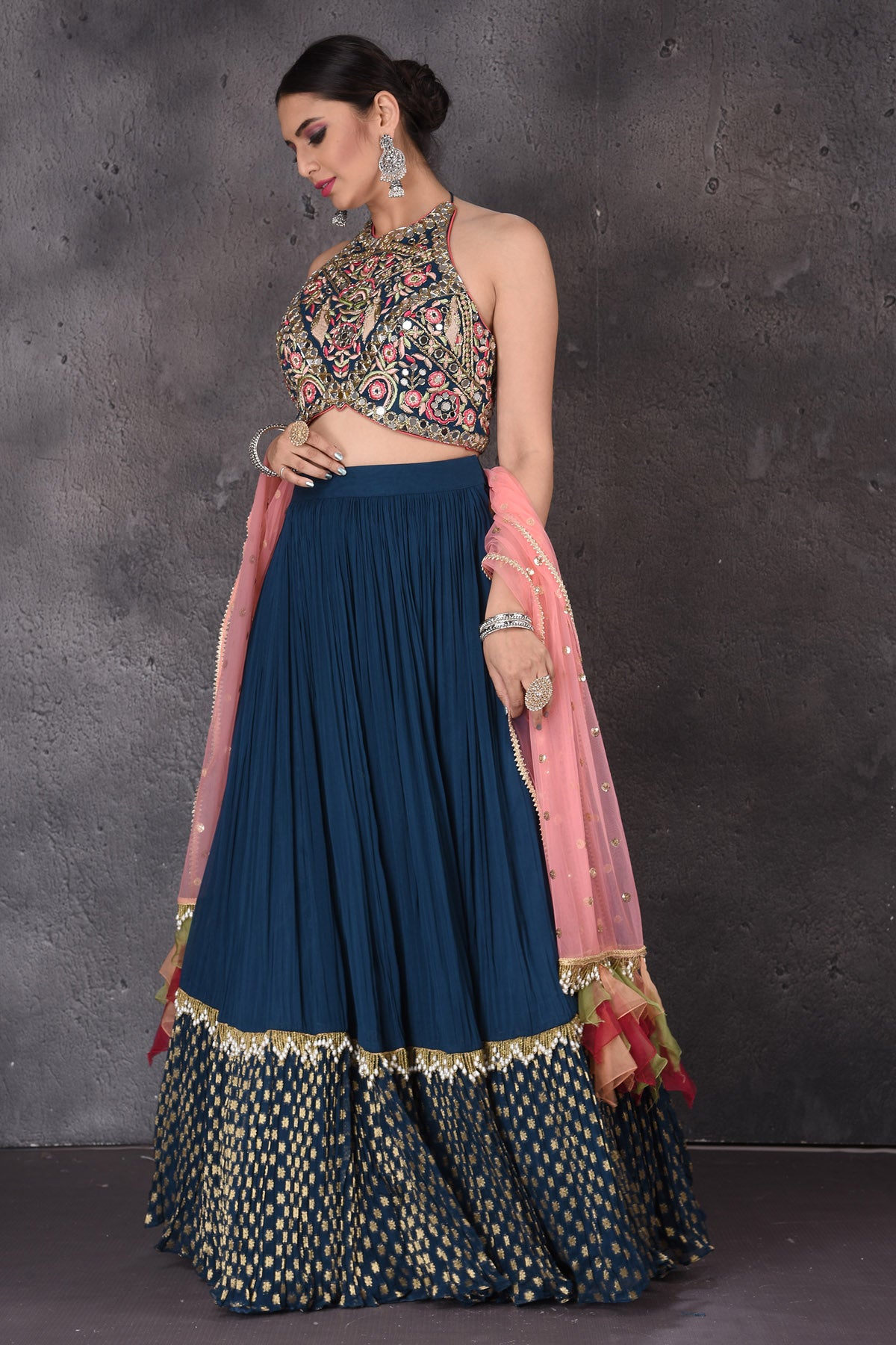 Buy stunning dark blue embroidered lehenga online in USA with pink dupatta. Look elegant at weddings and festive occasions in exclusive designer suits, designer gowns, Anarkali suits, sharara suits, wedding gowns, palazzo suits, designer lehenga from Pure Elegance Indian clothing store in USA.-side