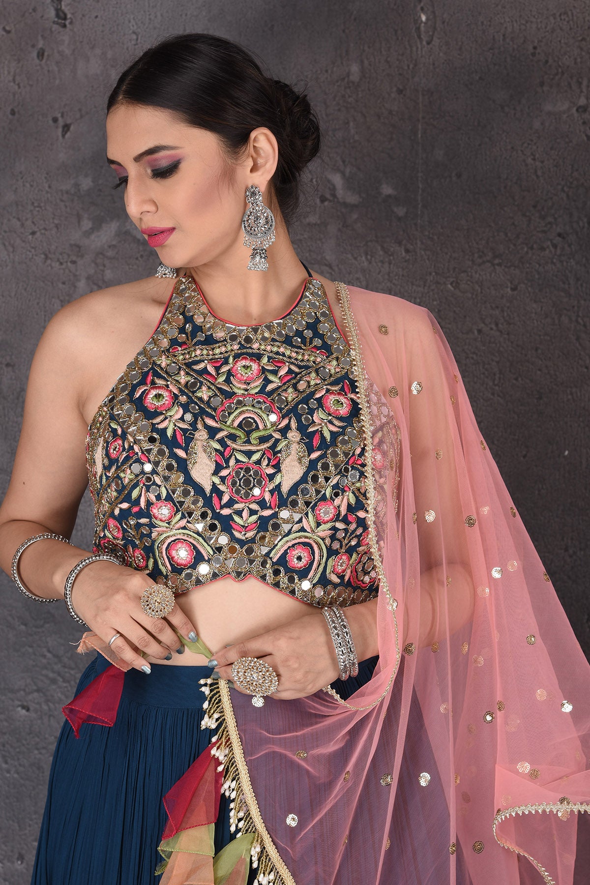 Buy stunning dark blue embroidered lehenga online in USA with pink dupatta. Look elegant at weddings and festive occasions in exclusive designer suits, designer gowns, Anarkali suits, sharara suits, wedding gowns, palazzo suits, designer lehenga from Pure Elegance Indian clothing store in USA.-closeup
