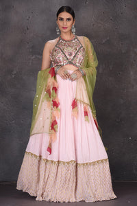 Buy elegant powder pink embroidered lehenga online in USA with green dupatta. Look elegant at weddings and festive occasions in exclusive designer suits, designer gowns, Anarkali suits, sharara suits, wedding gowns, palazzo suits, designer lehenga from Pure Elegance Indian clothing store in USA.-full view