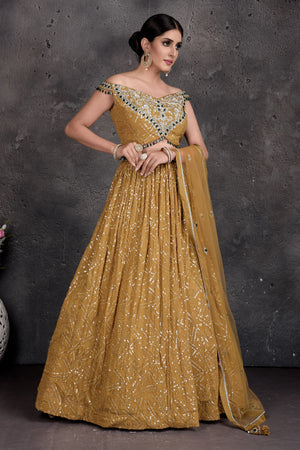 Buy stunning mustard embroidered off-shoulder lehenga online in USA. Set a fashion statement at parties in designer dresses, Anarkali suits, designer lehengas, gowns, Indowestern dresses from Pure Elegance Indian fashion store in USA.-side