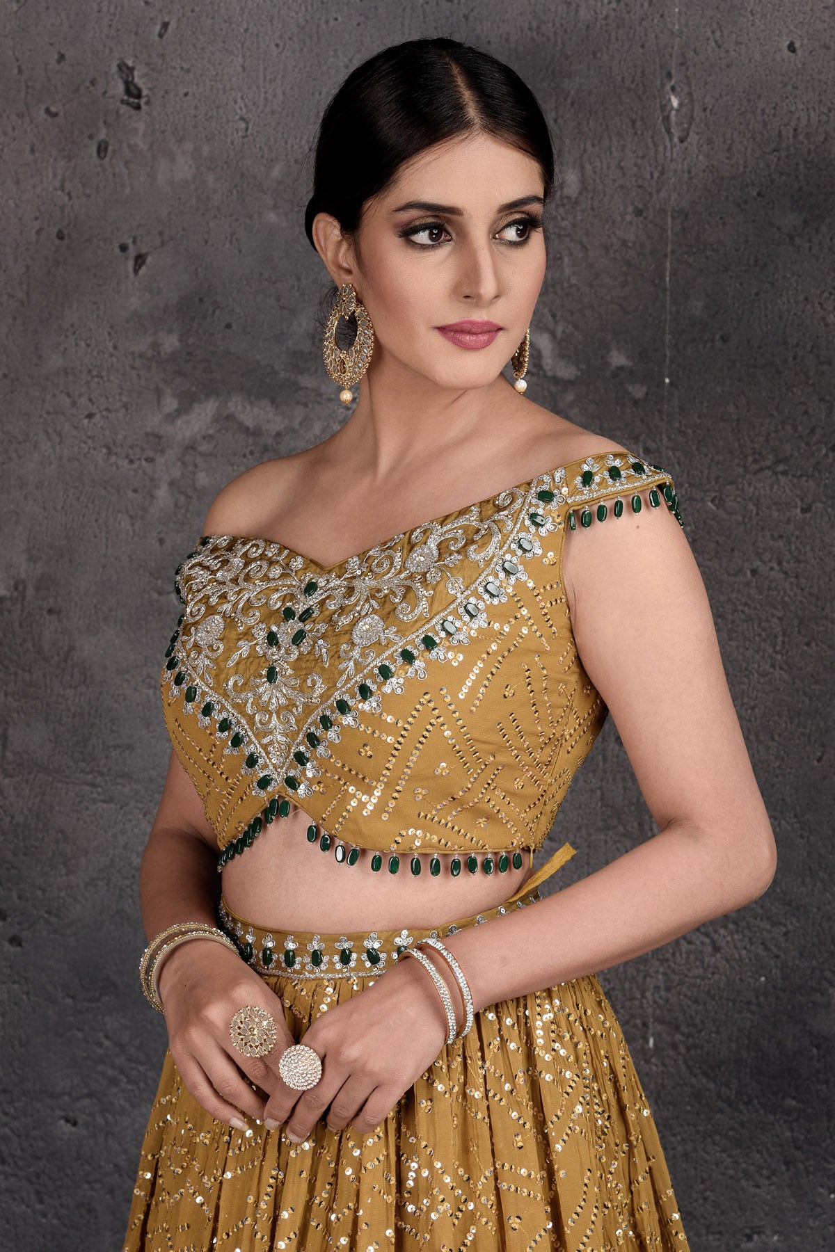 Buy stunning mustard embroidered off-shoulder lehenga online in USA. Set a fashion statement at parties in designer dresses, Anarkali suits, designer lehengas, gowns, Indowestern dresses from Pure Elegance Indian fashion store in USA.-closeup