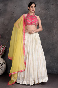 Shop beautiful pink and cream embroidered lehenga online in USA with yellow dupatta. Set a fashion statement at parties in designer dresses, Anarkali suits, designer lehengas, gowns, Indowestern dresses from Pure Elegance Indian fashion store in USA.-full view