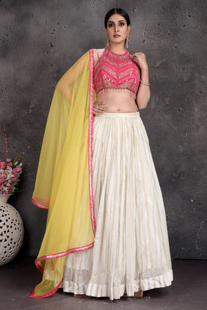 Shop beautiful pink and cream embroidered lehenga online in USA with yellow dupatta. Set a fashion statement at parties in designer dresses, Anarkali suits, designer lehengas, gowns, Indowestern dresses from Pure Elegance Indian fashion store in USA.-front