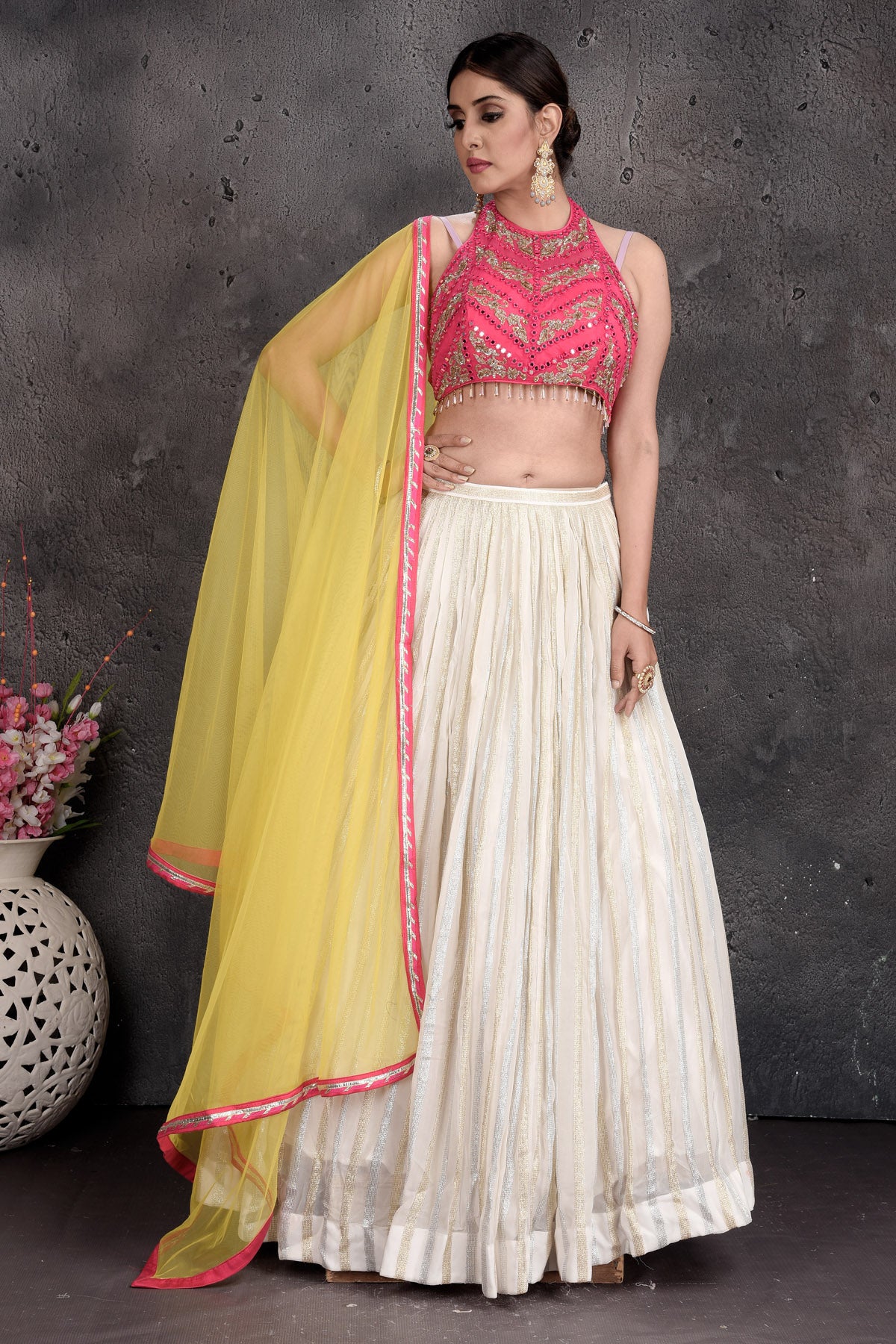 Shop beautiful pink and cream embroidered lehenga online in USA with yellow dupatta. Set a fashion statement at parties in designer dresses, Anarkali suits, designer lehengas, gowns, Indowestern dresses from Pure Elegance Indian fashion store in USA.-skirt