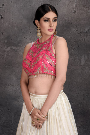 Shop beautiful pink and cream embroidered lehenga online in USA with yellow dupatta. Set a fashion statement at parties in designer dresses, Anarkali suits, designer lehengas, gowns, Indowestern dresses from Pure Elegance Indian fashion store in USA.-closeup