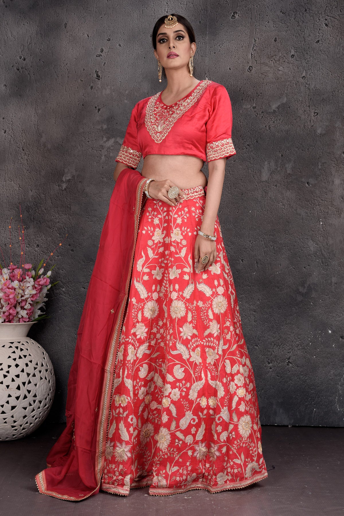 Buy tomato red embroidered designer lehenga online in USA with dupatta. Set a fashion statement at parties in designer dresses, Anarkali suits, designer lehengas, gowns, Indowestern dresses from Pure Elegance Indian fashion store in USA.-side