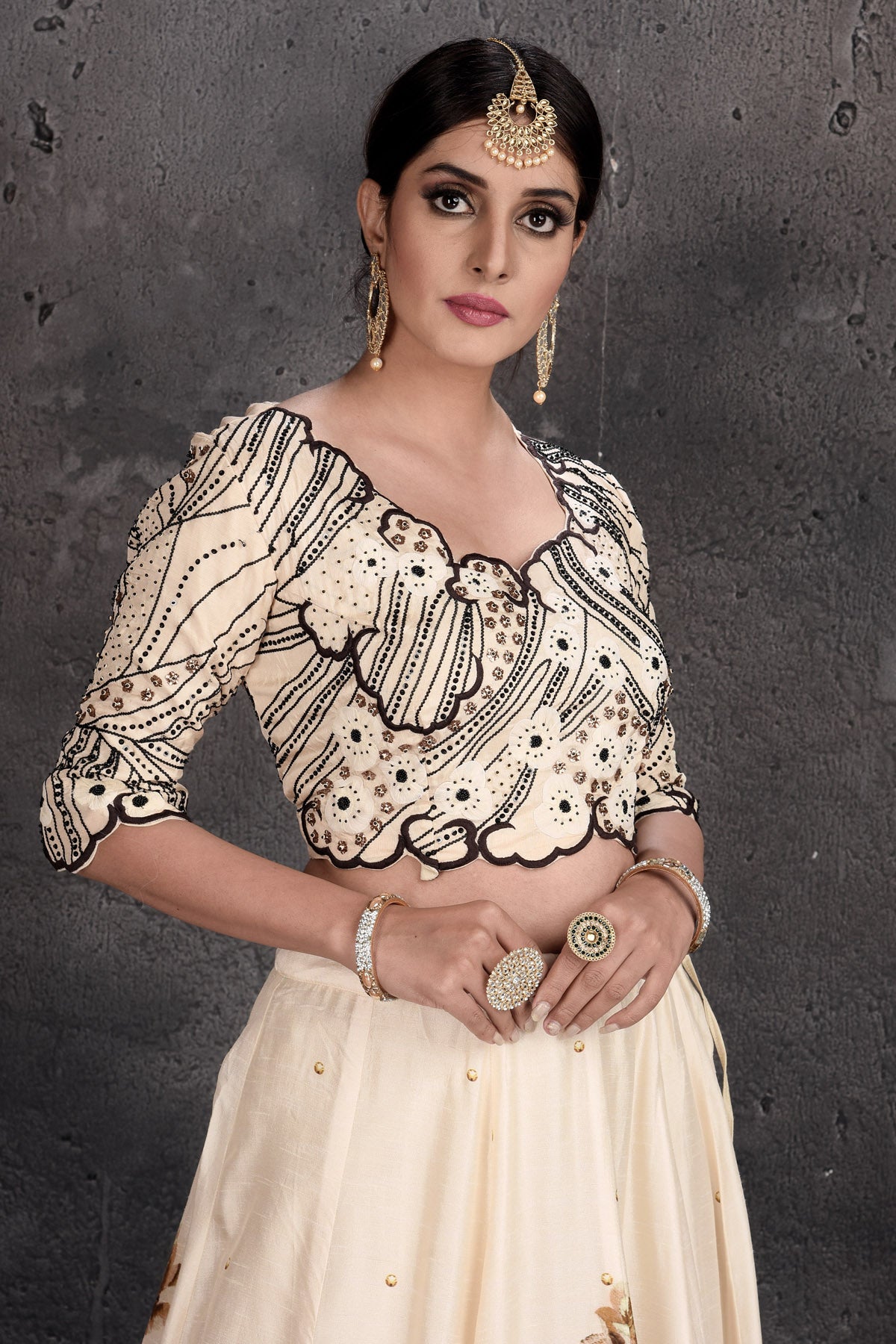 Buy stunning cream embroidered designer lehenga online in USA with dupatta. Set a fashion statement at parties in designer dresses, Anarkali suits, designer lehengas, gowns, Indowestern dresses from Pure Elegance Indian fashion store in USA.-closeup