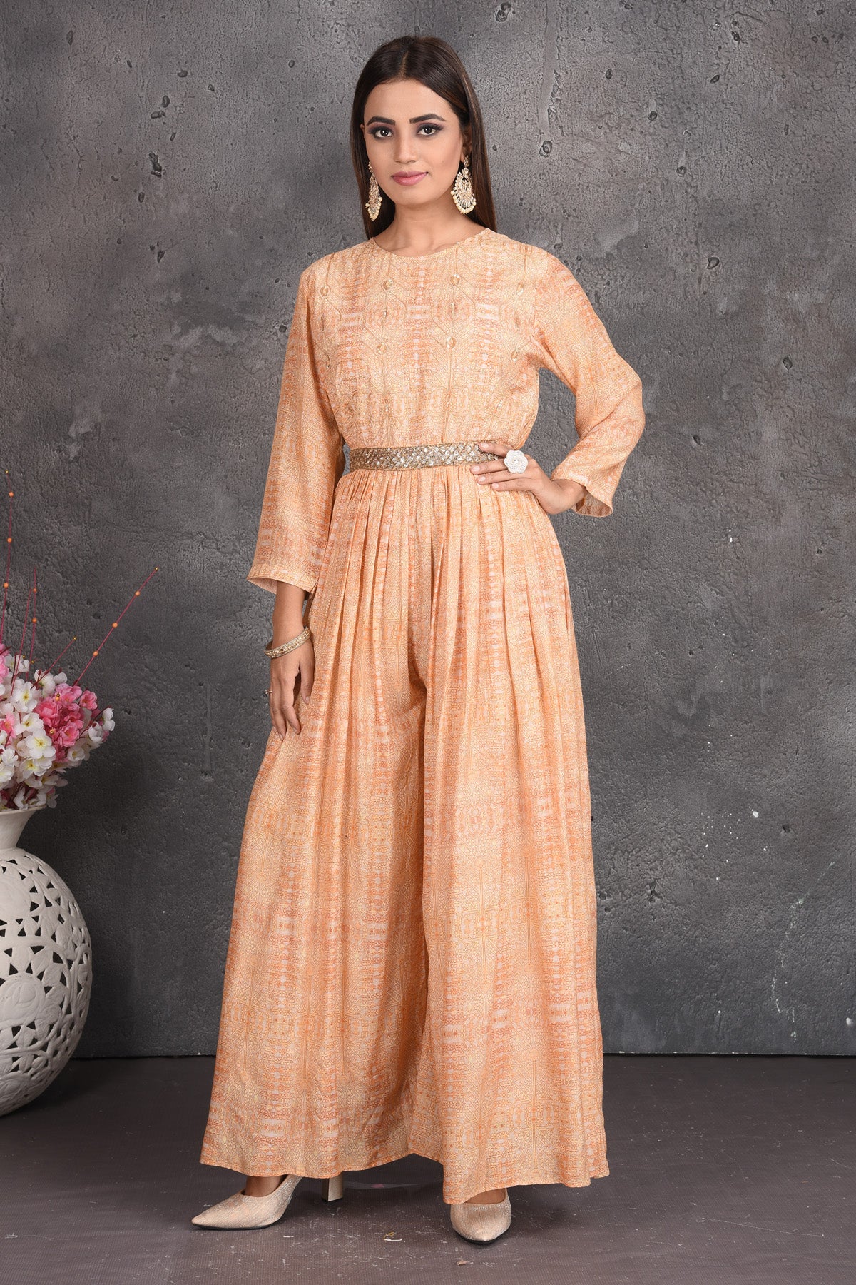 Buy beautiful peach designer jumpsuit online in USA with embellished belt. Set a fashion statement at parties in designer dresses, Anarkali suits, designer lehengas, gowns, Indowestern dresses from Pure Elegance Indian fashion store in USA.-full view