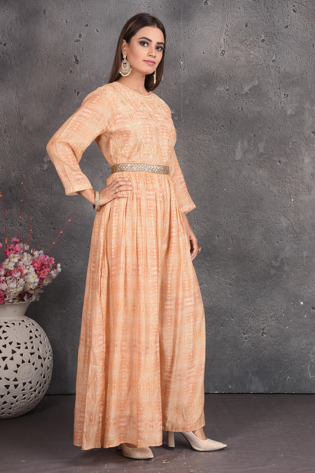 Buy beautiful peach designer jumpsuit online in USA with embellished belt. Set a fashion statement at parties in designer dresses, Anarkali suits, designer lehengas, gowns, Indowestern dresses from Pure Elegance Indian fashion store in USA.-right