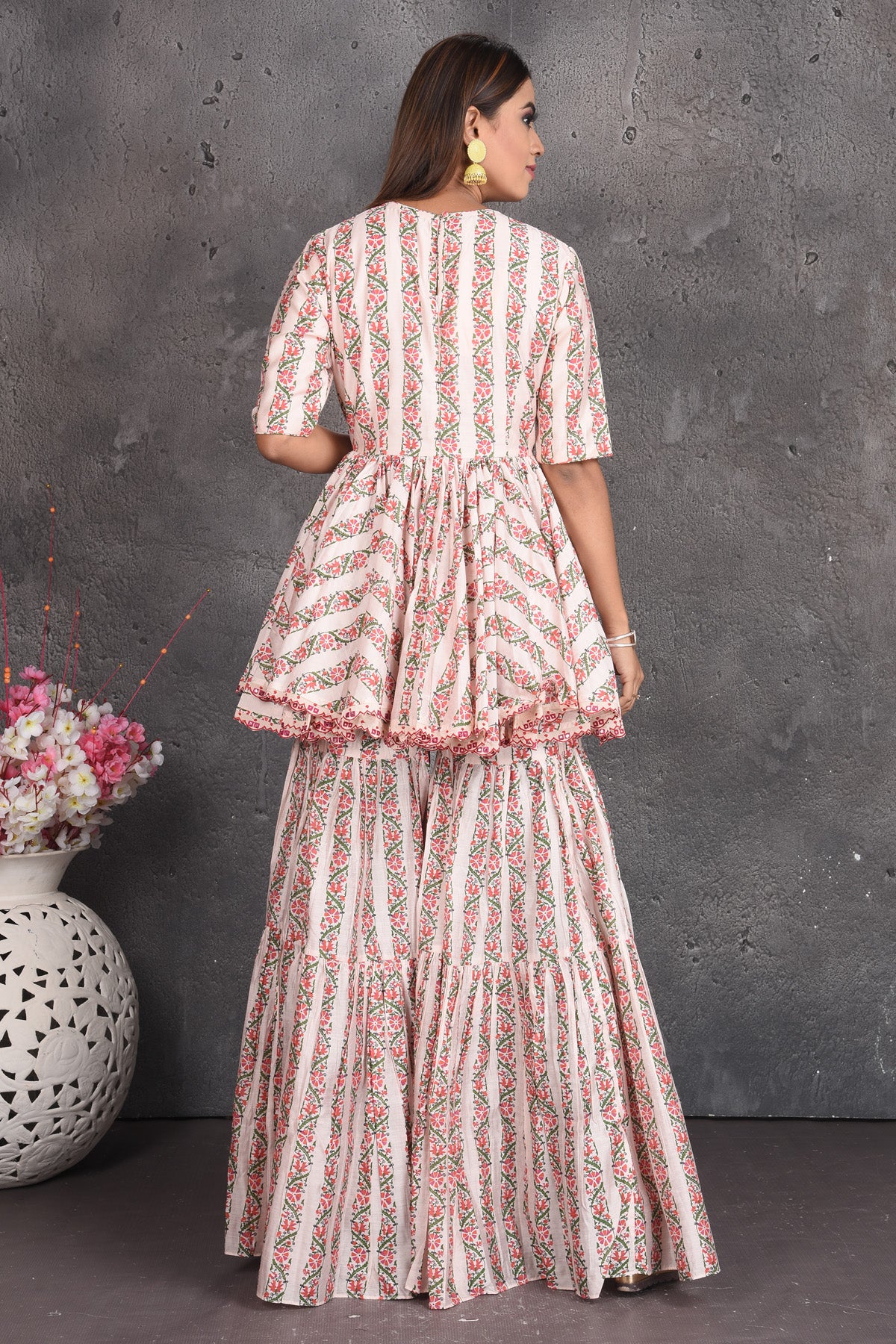 Buy cream printed peplum sharara suit online in USA with dupatta. Set a fashion statement at parties in designer dresses, Anarkali suits, designer lehengas, gowns, Indowestern dresses from Pure Elegance Indian fashion store in USA.-back