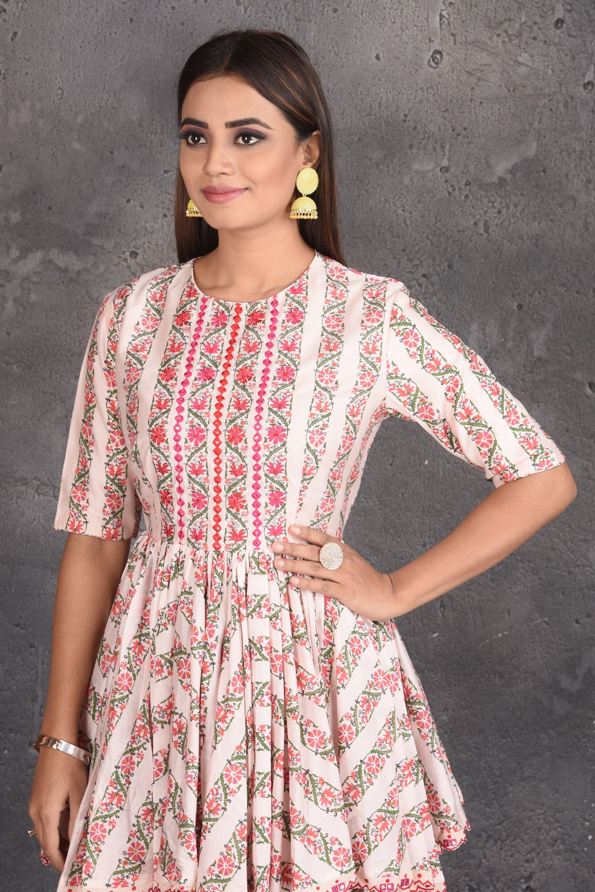 Buy cream printed peplum sharara suit online in USA with dupatta. Set a fashion statement at parties in designer dresses, Anarkali suits, designer lehengas, gowns, Indowestern dresses from Pure Elegance Indian fashion store in USA.-closeup