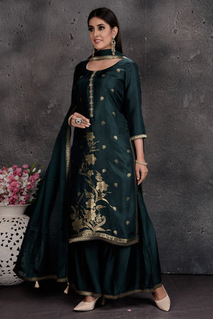 Shop beautiful bottle green embroidered palazzo suit online in USA with dupatta. Set a fashion statement at parties in designer Indian dresses, Anarkali suits, designer lehengas, gowns, Indowestern dresses from Pure Elegance Indian fashion store in USA.-left