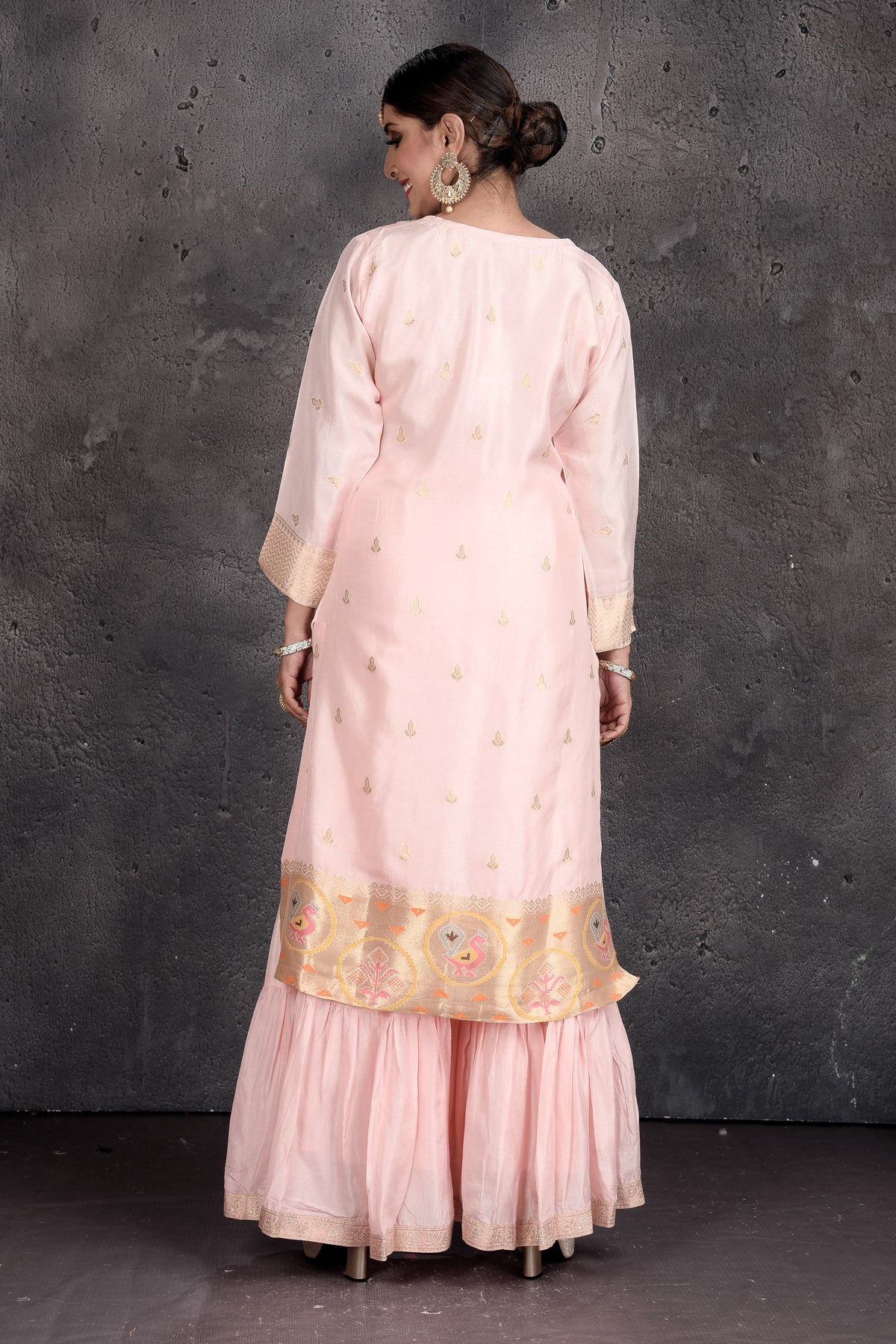 Shop beautiful powder pink embroidered sharara suit online in USA with dupatta. Set a fashion statement at parties in designer Indian dresses, Anarkali suits, designer lehengas, gowns, Indowestern dresses from Pure Elegance Indian fashion store in USA.-back