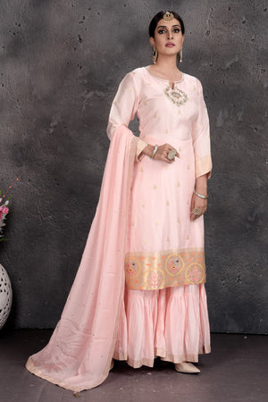 Shop beautiful powder pink embroidered sharara suit online in USA with dupatta. Set a fashion statement at parties in designer Indian dresses, Anarkali suits, designer lehengas, gowns, Indowestern dresses from Pure Elegance Indian fashion store in USA.-side