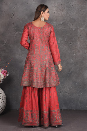 Buy beautiful tomato red embroidered sharara suit online in USA with grey dupatta. Set a fashion statement at parties in designer dresses, Anarkali suits, designer lehengas, gowns, Indowestern dresses from Pure Elegance Indian fashion store in USA.-back