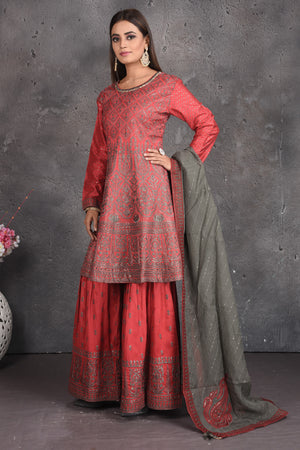 Buy beautiful tomato red embroidered sharara suit online in USA with grey dupatta. Set a fashion statement at parties in designer dresses, Anarkali suits, designer lehengas, gowns, Indowestern dresses from Pure Elegance Indian fashion store in USA.-side